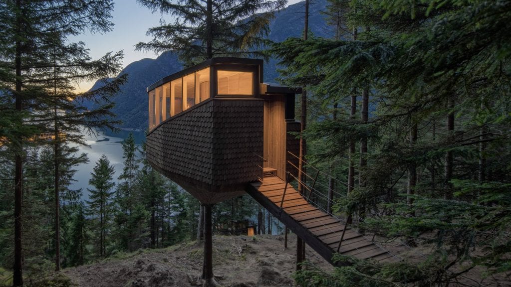 Helen & Hard hangs Woodnest treehouses from pine trees above Norwegian fjord